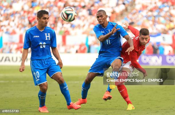England's Ross Barkley gets a shot off on goal despite the attentions of Honduras' Jerry Bengtson