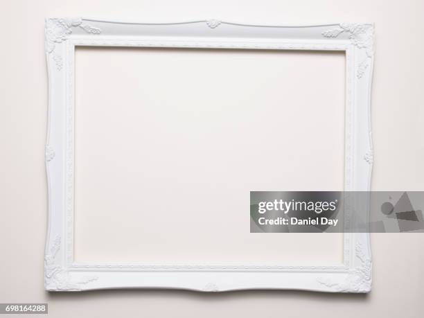 empty white frame on a white background - image frame stock pictures, royalty-free photos & images