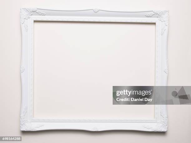 empty white frame on a white background - picture frame stock pictures, royalty-free photos & images