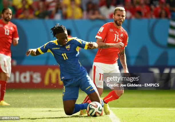 Ecuador's Felipe Caicedo and Switzerland's Valon Behrami battle for the ball