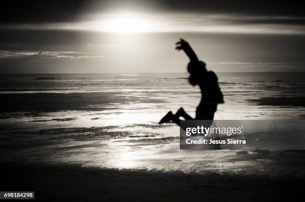 girl jumped in parque natural dunas de liencres - sierra de cantabria imagens e fotografias de stock