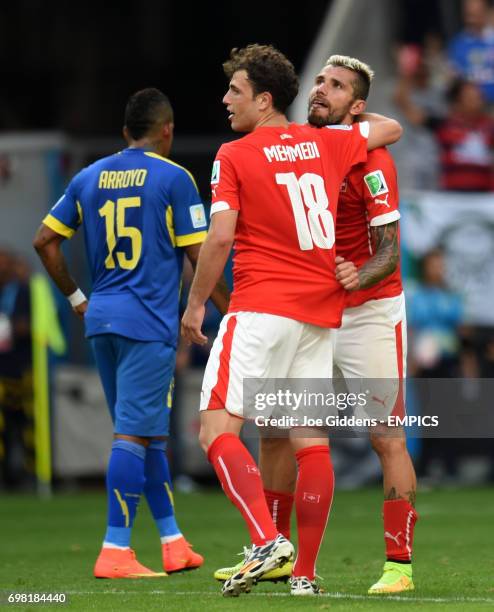 Switzerland's Admir Mehmedi celebrates with team mate Switzerland's Valon Behrami