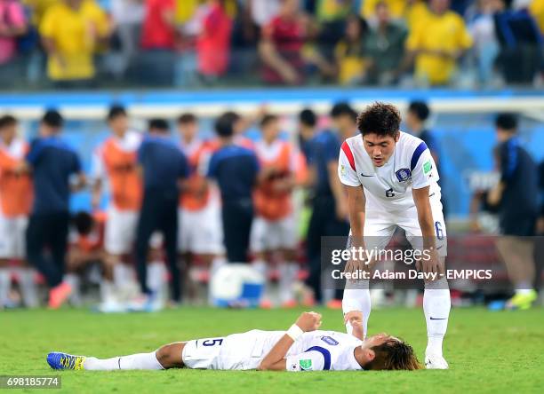 South Korea's Kim Young-Gwon and Hwang Seok-Ho after the final whistle