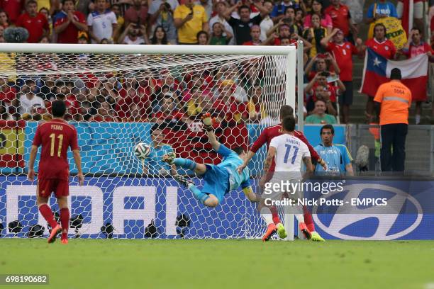 Spain goalkeeper Iker Casillas fails to stop his side from conceding their second goal, scored by Chile's Charles Aranguiz