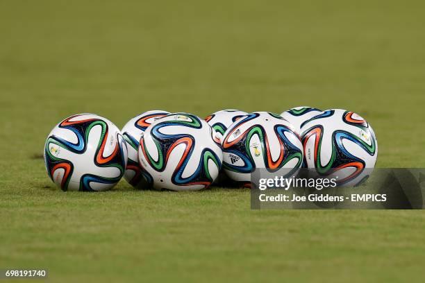 Brazuca footballs on the pitch before a training session at Arena das Dunas in Natal