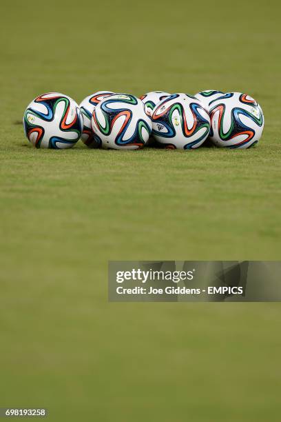 Brazuca footballs on the pitch before a training session at Arena das Dunas in Natal