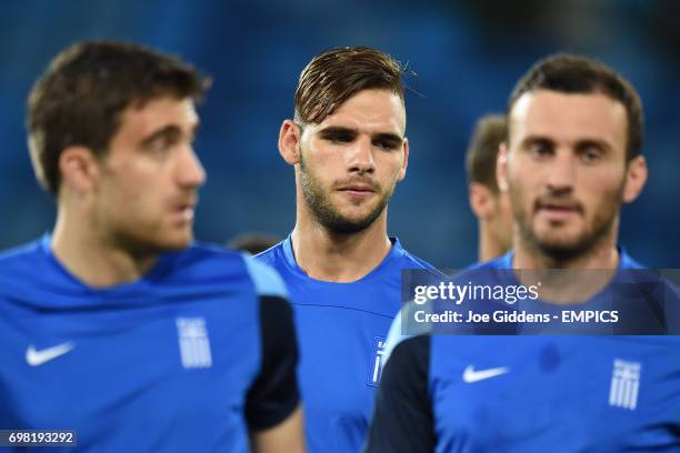 Greece's Sokratis Papastathopoulos , Panagiotis Tachtsidis and Dimitrios Salpingidis during a training session at Arena das Dunas in Natal