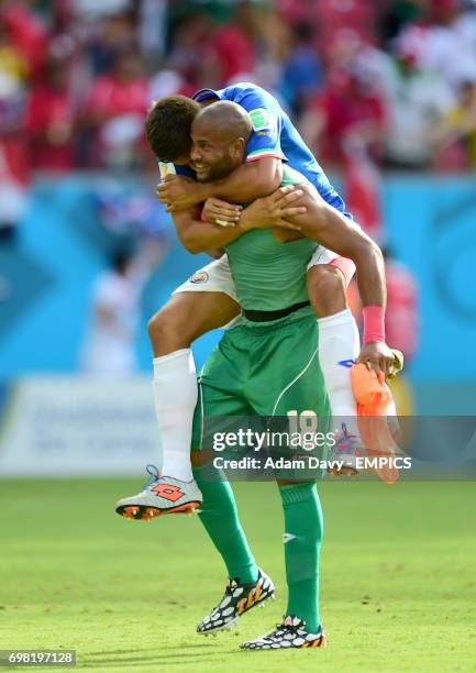 Costa Rica goalkeeper Patrick Pemberton celebrates with teammate Esteban Granados after the final whistle