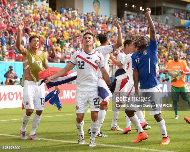 Costa Rica's Jose Cubero Joel Campbell and Esteban Granados celebrate after the final whistle