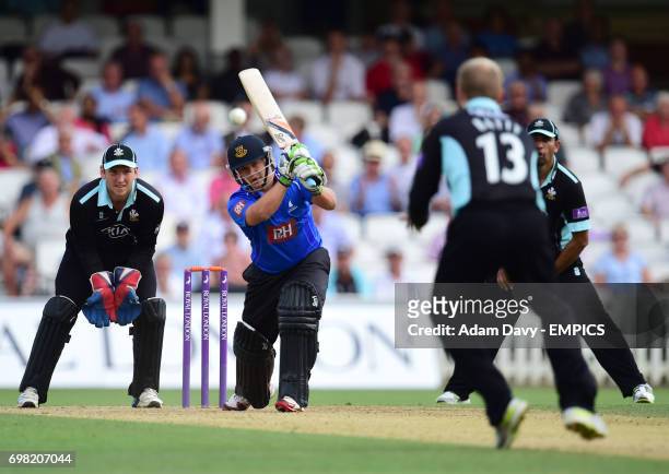 Sussex's Craig Cachopa hits out off the bowling of Surrey's Gareth Batty