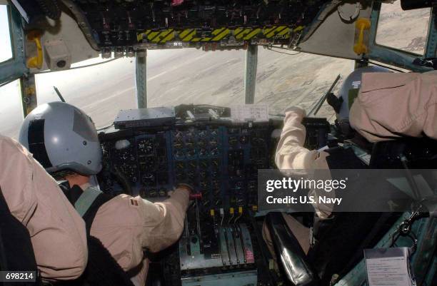 Air Force C-130 Hercules crew makes their approach February 7, 2002 to Kandahar International Airport in Afghanistan. The crew are delivering...