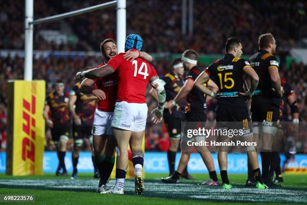 Jack Nowell of the Lions is congratulated by teammate Greig Laidlaw of the Lions after scoring their team's opening try during the 2017 British &...