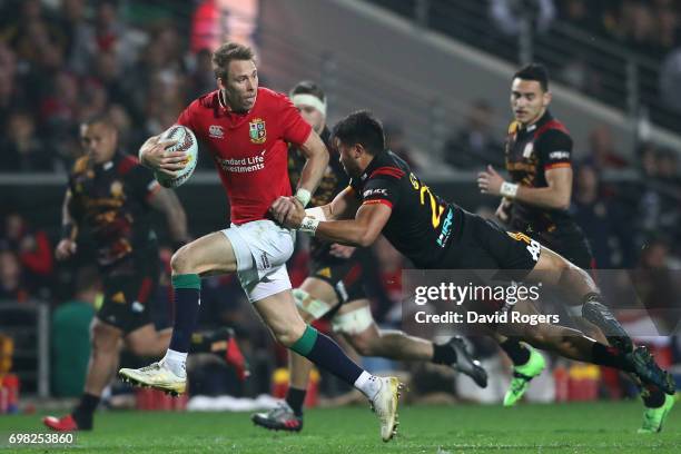 Liam Williams of the Lions looks for support as he is tackled by Jonathan Taumateine of the Chiefs during the 2017 British & Irish Lions tour match...