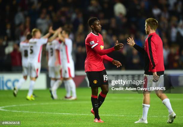 Manchester United's Danny Welbeck walks off the pitch dejected.