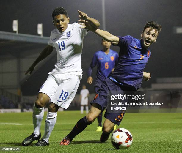 England's Demetri Mitchell and The Netherlands' Gustavo Hamer in action