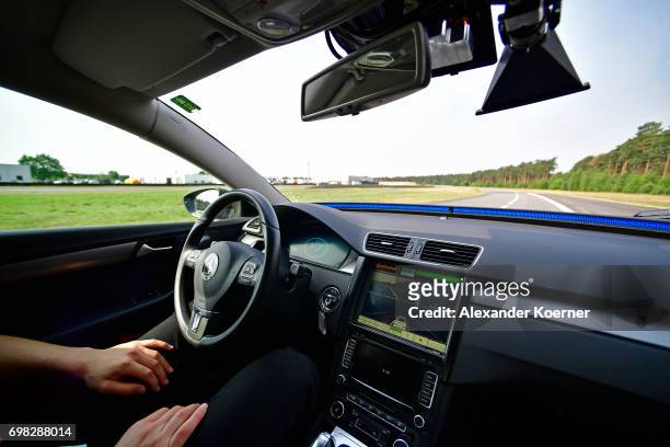 Driver presents a Cruising Chauffeur, a hands free self-driving system designed for motorways during a media event by Continental to showcase new...