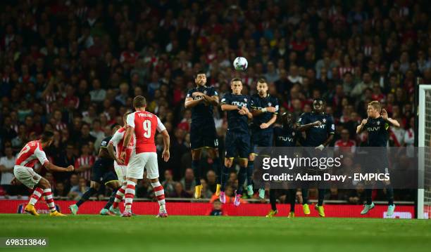 Arsenal's Alexis Sanchez scores the first goal from a free kick