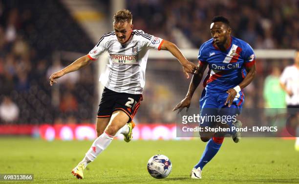 Fulham's Lasse Vigen Christensen and Doncaster Rovers' Cedric Evina compete for the ball