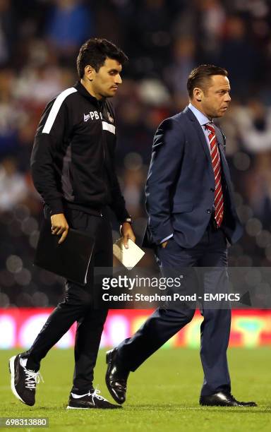 Doncaster Rovers' Manager Paul Dickov leaves the field at half time