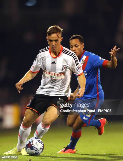 Fulham's Lasse Vigen Christensen and Doncaster Rovers' Kyle Bennett compete for the ball