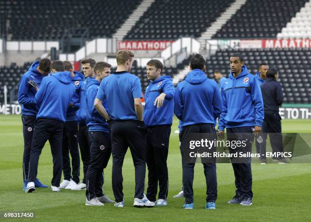 Reading players talk on the pitch prior to the game