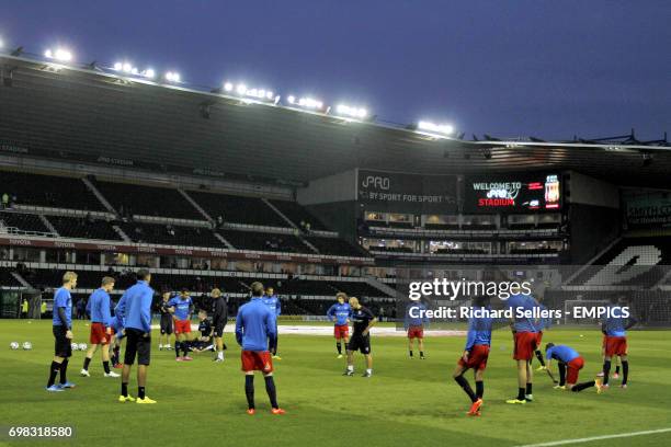 Reading players training on the pitch prior to the game