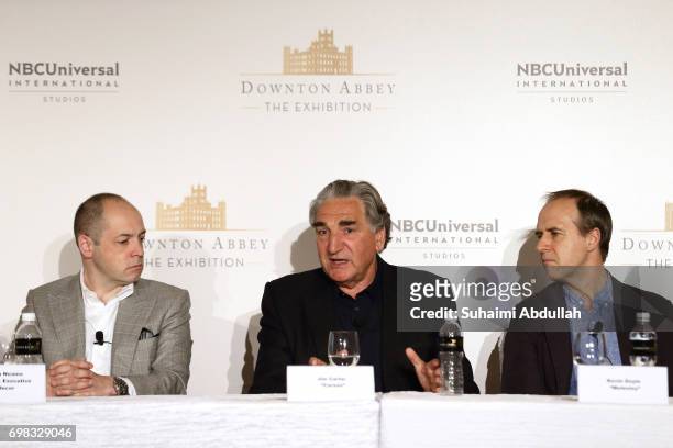 Gareth Neame and Kevin Doyle looks on as Jim Carter speaks during the Downtown Abbey: The Exhibition press conference at the Sands Expo and...