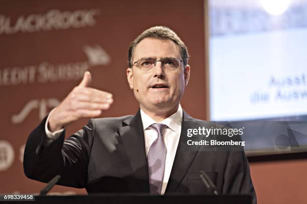 Thomas Jordan, president of the Swiss National Bank , gestures as he speaks during the Swiss International Finance Forum in Bern, Switzerland, on...