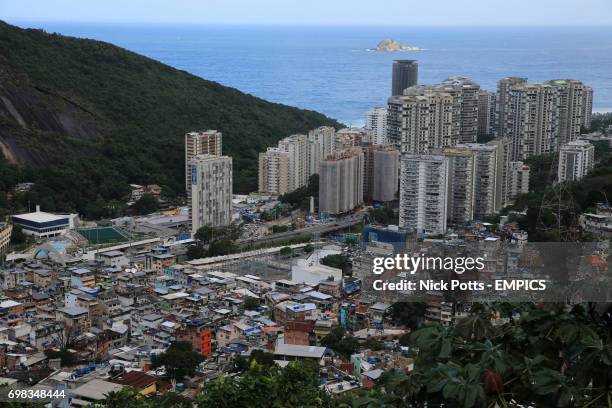 Rio De Janeiro, Brazil views of daily life in Rocinha Favela high up overlooking the homes of a population of around 300,000 people looking towards...