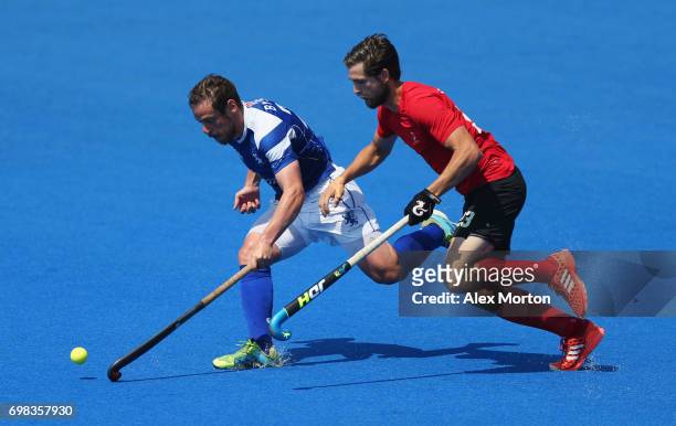 Gavin Byers of Scotland and Iain Smythe of Canada battle for the ball during the Pool B match between Scotland and Canada on day six of the Hero...