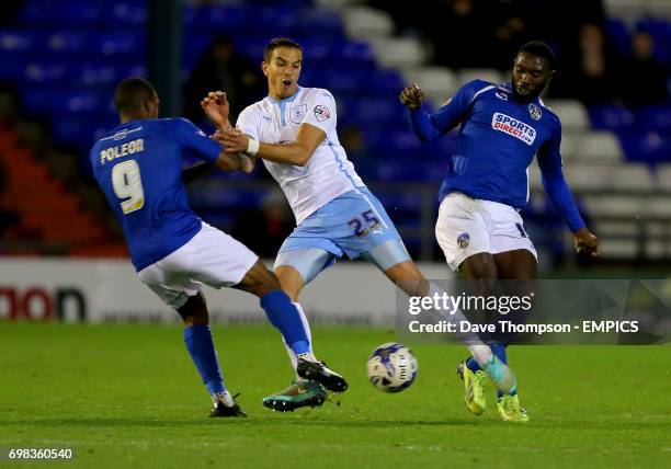 Coventry City's Sebastian Hines in action with Oldham Athletic's Dominic Poleon and Jonathan Forte