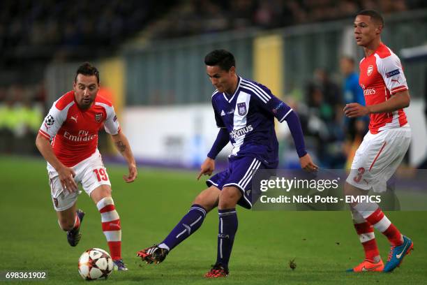 Anderlecht's Andy Najar passes the ball away from Arsenal's Santi Cazorla