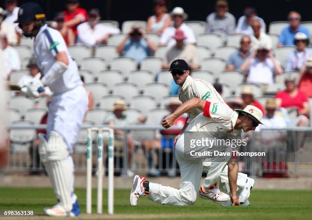 Ryan McLaren of Lancashire takes a catch off the bowling of James Anderson to dismiss Brad Taylor of Hampshire during day two of the Specsavers...