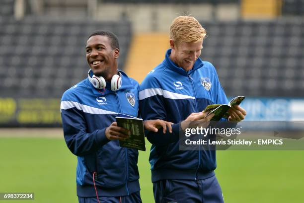 Oldham Athletic's Dominic Poleon and Adam Lockwood share a joke during a pre-match pitch walk around Meadow Lane