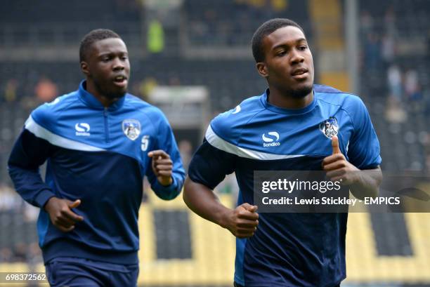 Oldham Athletic's Genseric Kusunga and Dominic Poleon warm-up before the game