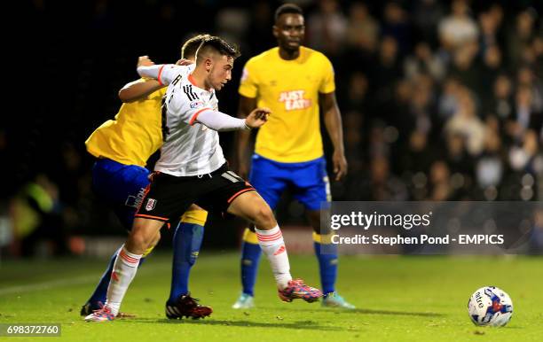 Fulham's Patrick Roberts and Derby County's Craig Forsyth compete for the ball