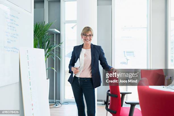 women working together - blue blazer stock pictures, royalty-free photos & images