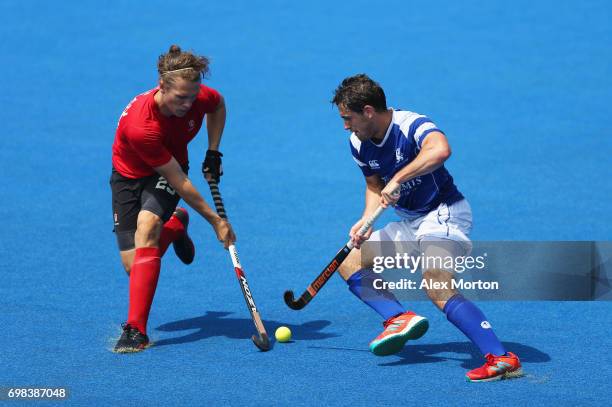 Taylor Curran of Canada and Timothy Atkins of Scotland battle for the ball during the Pool B match between Scotland and Canada on day six of the Hero...