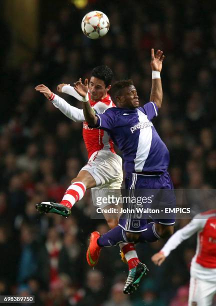 Arsenal's Mikel Arteta and Anderlecht's Gohi Bi Zorro Cyriac battle for the ball in the air