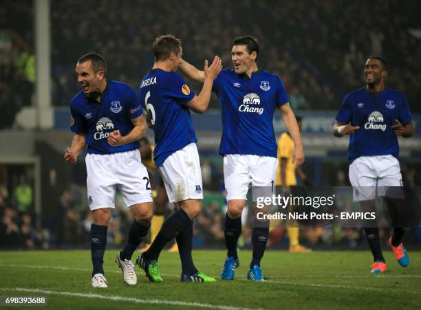 Everton's Phil Jagielka celebrates scoring his sides second goal of the game with team-mates Leon Osman and Gareth Barry