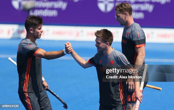 Thierry Brinkman of the Netherlands celebrates scoring their first goal with team mates during the Pool B match between India and the Netherlands on...