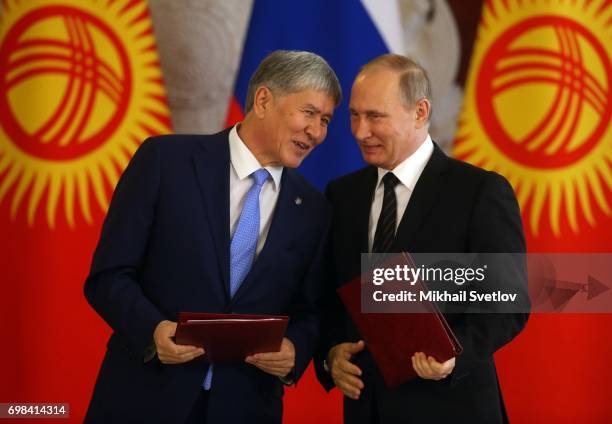 Russian President Vladimir Putin listens to Kyrgyz President Almazbek Atambayev during their talks at the Grand Kremlin Palace on June 20, 2017 in...