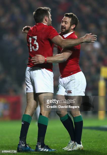 Jared Payne of the Lions is congratulated by team mate Greig Laidlaw after scoring a try during the match between the Chiefs and the British & Irish...