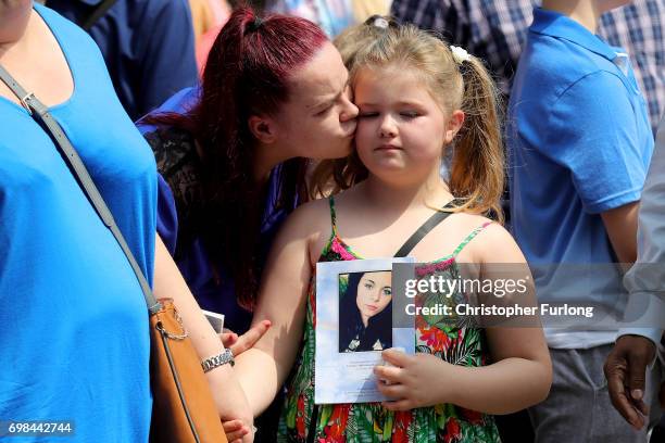 Mourners look on as the coffin of Manchester attack victim Olivia Campbell-Hardy leaves The Parish Church of St Anne, in Tottington after her funeral...