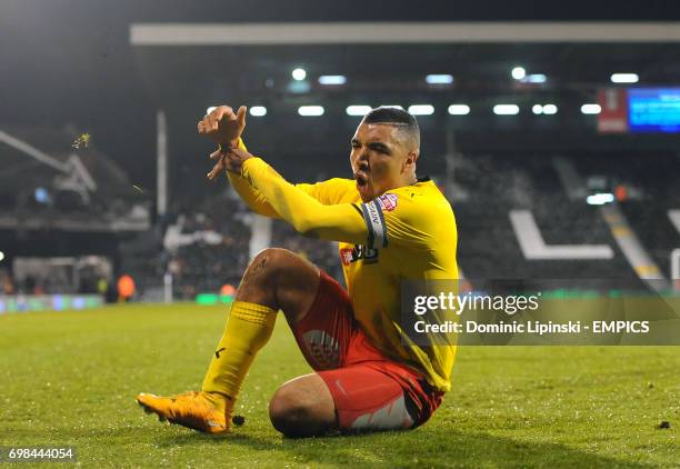 Watford's Troy Deeney celebrates scoring his side's third goal during the Sky Bet Championship match at Craven Cottage, London.