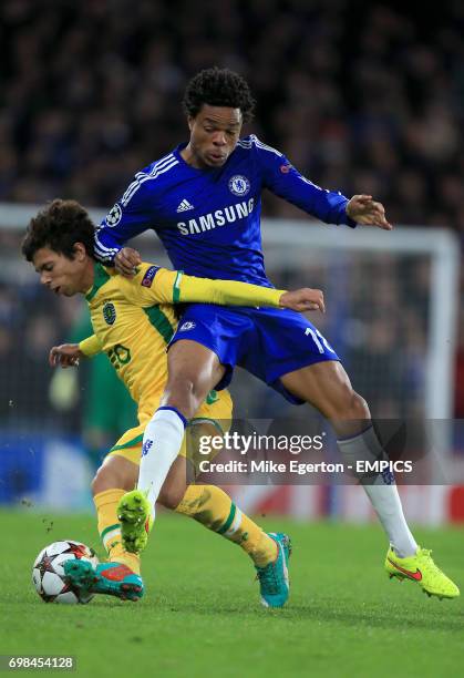 Chelsea's Loic Remy and Sporting Lisbon's Andre Martins battle for the ball.