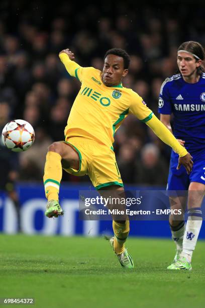 Sporting Lisbon's Andre Carrillo wins the ball ahead of Chelsea's Filipe Lus