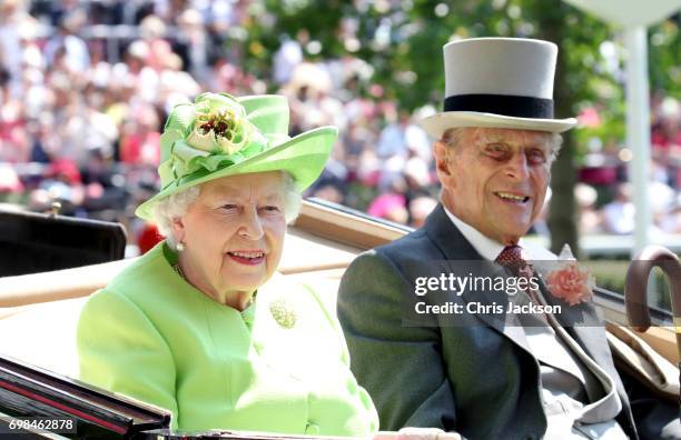 Queen Elizabeth II and Prince Philip, Duke of Edinburgh arrive with the Royal Procession as they attend Royal Ascot 2017 at Ascot Racecourse on June...