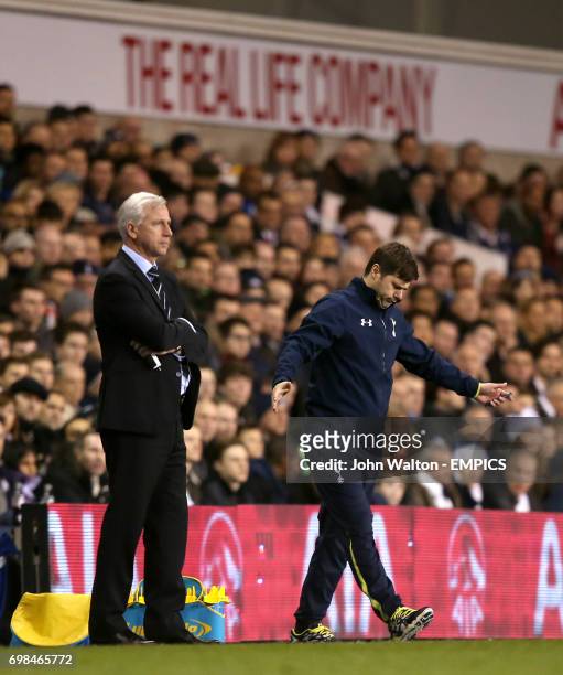 Tottenham Hotspur manager Mauricio Pochettino gestures from the touchline as Newcastle United manager Alan Pardew stands