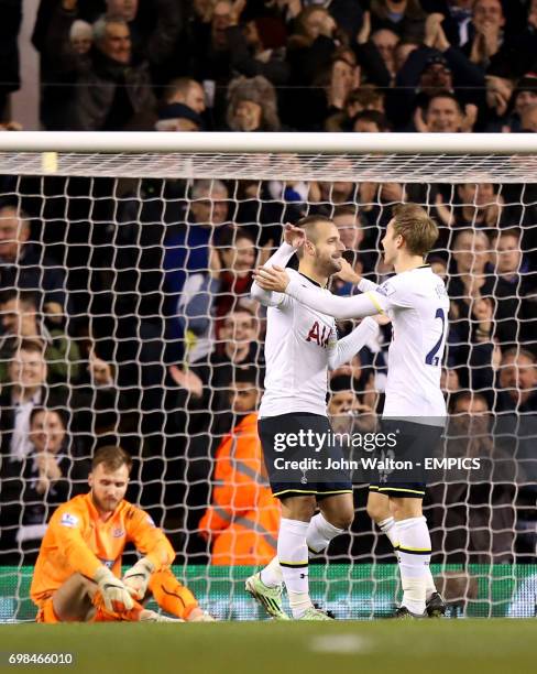 Tottenham Hotspur's Roberto Soldado celebrates scoring is side's fourth goal of the game with teammate Christian Eriksen as Newcastle United...